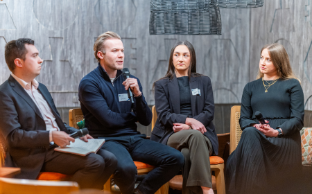 Four UCD alumni speaking on a panel.